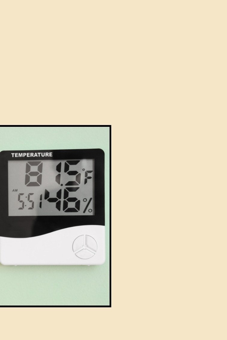 Digital hygrometer display showing temperature and humidity readings